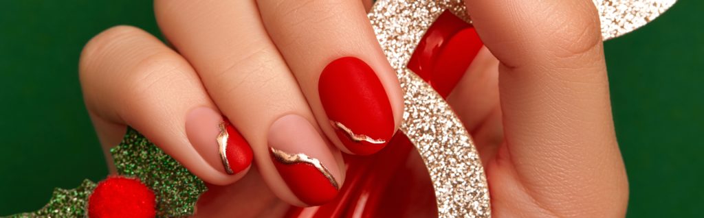 red nail polish with gold detail